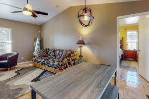 a living room with a couch and a table at Cape Escape in Cape Coral