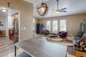 a living room with a wooden table and chairs at Cape Escape in Cape Coral