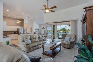 a living room with a couch and chairs and a table at Sable Retreat in Cape Coral