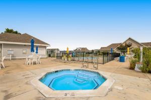 a swimming pool in the middle of a yard at Bethany Bay --- 37182 Harbor Dr #2606 in Ocean View