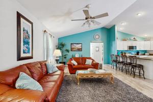 a living room with a couch and a table at Ocean Way Estates - 32563 W Riga Dr in Ocean View