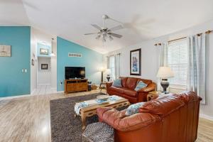 a living room with a couch and a table at Ocean Way Estates - 32563 W Riga Dr in Ocean View