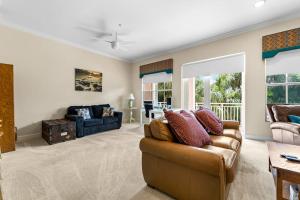 a living room with a couch and a table at White Coral in Placida