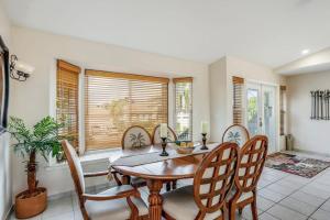 a dining room with a wooden table and chairs at Madagascar Palm in Marco Island +40 photos