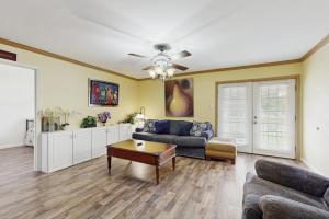 a living room with a couch and a table at Moose's House --- 70 Radcliffe Rd. in The Plantations