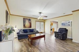 a living room with two couches and a coffee table at Moose's House --- 70 Radcliffe Rd. in The Plantations