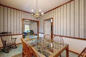 a dining room with a glass table and chairs at Salt Pond --- 669 Bethany Loop in Bethany Beach