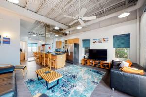 a living room with a couch and a table at Rehoboth Beach -- Forj Lofts #8 in Rehoboth Beach