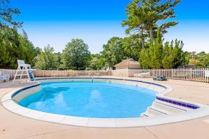 a large swimming pool in a yard at Sea Colony --- 2403 Round Robin in Bethany Beach