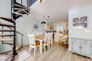 a kitchen and dining room with a table and chairs at Sea Colony --- 2403 Round Robin in Bethany Beach
