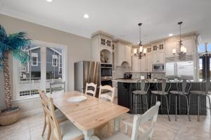 a large kitchen with a wooden table and chairs at Edgewater Acres --- 38874 Old Lighthouse Rd in Selbyville