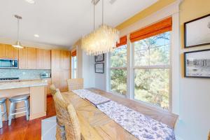 a kitchen and dining room with a table and chairs at Watermark North --- 38918 Silver Sands Dr in Bethany Beach