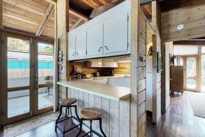 a kitchen with a counter and two stools in a room at Ann Acres 21039 Elizabeth Ave in Rehoboth Beach +14 photos
