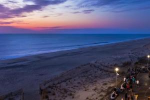 a view of the beach at sunset at Rehoboth Beach --- 18 Sabrina Dr in Lewes