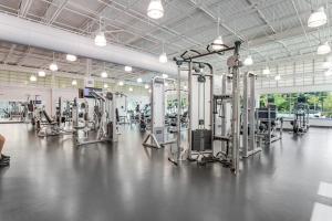 a gym with a lot of machines in it at Sea Colony --- 55084 Pinewood Circle in Bethany Beach