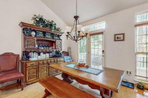a dining room with a table and a chair at South Hampton --- 33549 Water Mill Ln in Ocean View