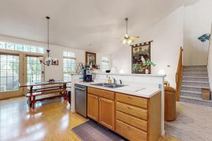 a large kitchen with a sink and a table at South Hampton --- 33549 Water Mill Ln in Ocean View +18 photos