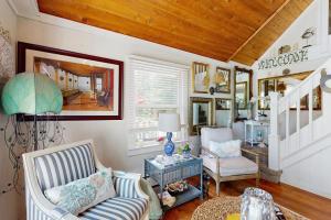 a living room with a couch and two chairs at Neck Village in Ocean View