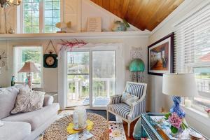 a living room with a couch and a table at Neck Village in Ocean View