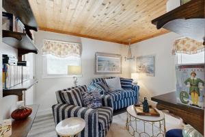 a living room with two chairs and a couch at Neck Village in Ocean View