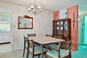 a dining room with a table and chairs at Tarpon Lagoon in Port Charlotte