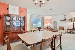a kitchen and dining room with a table and chairs at Tarpon Lagoon in Port Charlotte