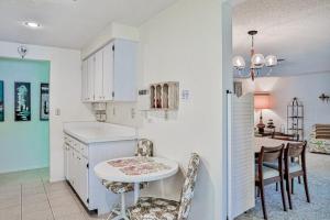 a kitchen and dining room with a table and chairs at Tarpon Lagoon in Port Charlotte +27 photos