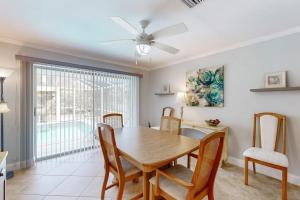 a dining room with a table and chairs at Seaside Serenity in Punta Gorda