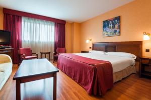 Łóżko lub łóżka w pokoju w obiekcie Hotel Las Provincias