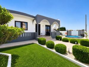 a house with a garden in front of it at Rhodian Villa in Kremasti