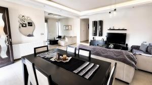 a living room with a table and a couch at Rhodian Villa in Kremasti