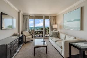 a living room with a couch and a table at Marco Beach Ocean Resort 807 in Marco Island