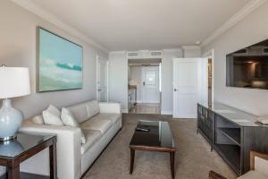 a living room with a couch and a table at Marco Beach Ocean Resort 807 in Marco Island