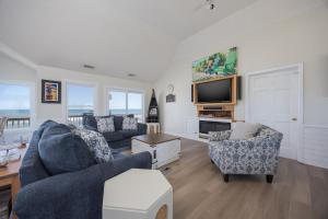 a living room with two couches and a tv at 7674 - The Sweet Escape in Avon