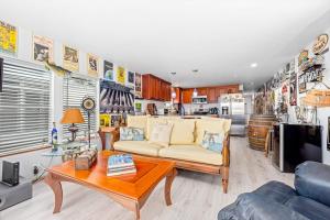 a living room with a couch and a table at Sunset Escape in Marco Island