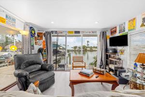 a living room with a couch and a table at Sunset Escape in Marco Island