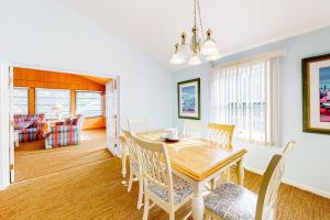 a dining room with a table and chairs at The Canal -- 337 Sandpiper in Bethany Beach