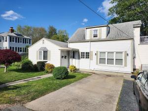 a white house with a driveway in front of it at Single Level Spacious Home - A JBMB Property in Middletown