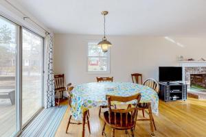 a dining room with a table and chairs at Corner Cottage in Chatham