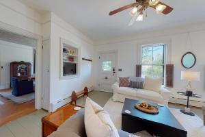 a living room with a couch and a table at Old Mansard in West Dennis