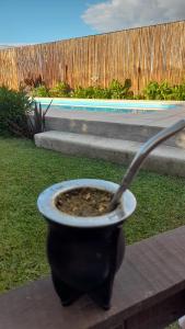 a pot sitting on a table next to a pool at La Su in Duggan +8 photos