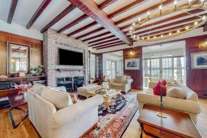 a living room filled with furniture and a fireplace at Capeview Estate in Bourne
