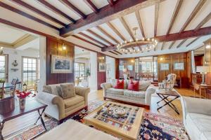 a living room with a couch and a table at Capeview Estate in Bourne