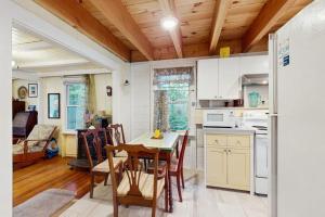 a kitchen and dining room with a table and chairs at TumbleINN in Oak Bluffs