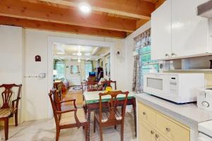 a kitchen and dining room with a table and chairs at TumbleINN in Oak Bluffs