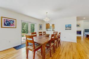 a dining room with a wooden table and chairs at Family Getaway in Oak Bluffs