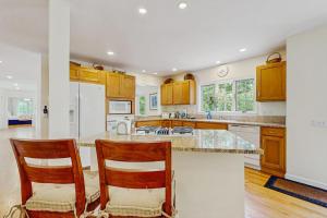 a kitchen with two chairs and a counter top at Family Getaway in Oak Bluffs