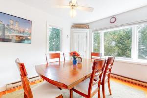 a dining room with a wooden table and chairs at Main Street Upper in Vineyard Haven