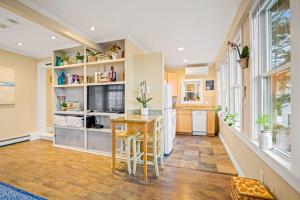 a kitchen with a table and chairs in a room at Lady Burns' Lookout in Provincetown