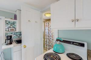 a kitchen with a teapot on top of a stove at Bayview Escape in Provincetown